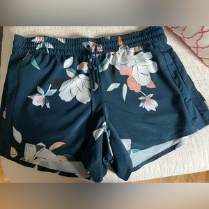 Athleta blue floral shorts in size 12